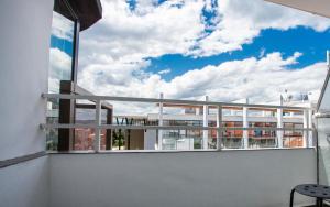 a balcony with a view of a building at Hotel Mistral in Nesebar