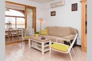 a living room with a couch and chairs and a table at GRAN VISTA in Santa Pola
