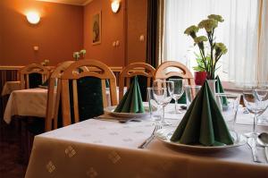 Reštaurácia alebo iné gastronomické zariadenie v ubytovaní Pensjonat Beata