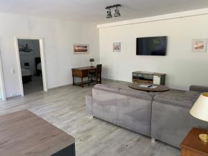 TV a/nebo společenská místnost v ubytování Gästehaus Schewe
