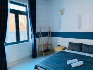 Postel nebo postele na pokoji v ubytování November Villa Đà Lạt