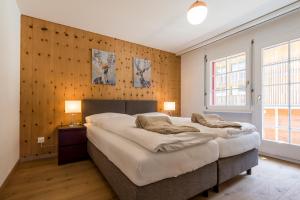 Montela Hotel & Resort - Haus Antares tesisinde bir odada yatak veya yataklar