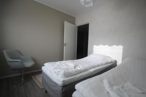A bed or beds in a room at Jääskän Loma, Ratatie 3 asunto 1
