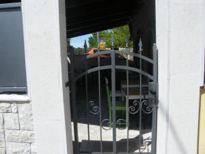 a door to a building with a wrought iron gate at Apartment Mamut in Premantura