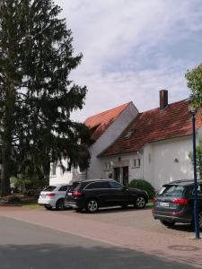 a group of cars parked in front of a house at FEWO-ATLANTA Reinhardshausen in Reinhardshausen