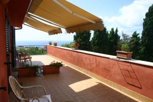 a balcony with a view of the ocean at casa vacanze marzano in Tropea