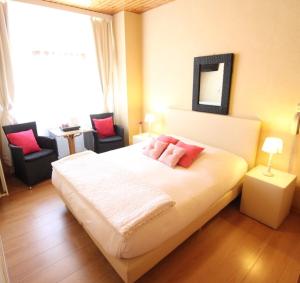 Postel nebo postele na pokoji v ubytování Hotel Georges
