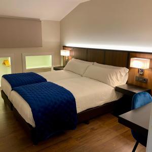 En eller flere senge i et værelse på Harpazul