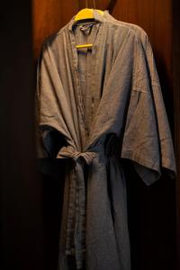 a robe is hanging on a hanger at Phor Liang Meun Terracotta Arts in Chiang Mai