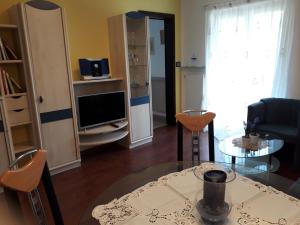A television and/or entertainment centre at GRETL - Residence