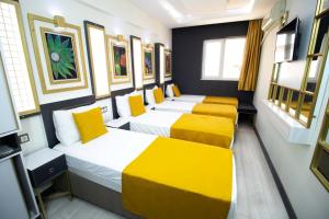Postel nebo postele na pokoji v ubytování Exporoyal Hotel