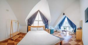 Postel nebo postele na pokoji v ubytování T&K Guesthouse