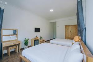 Postel nebo postele na pokoji v ubytování T&K Guesthouse