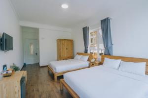 Postel nebo postele na pokoji v ubytování T&K Guesthouse