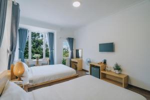 Postel nebo postele na pokoji v ubytování T&K Guesthouse