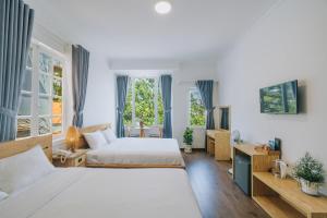 Postel nebo postele na pokoji v ubytování T&K Guesthouse