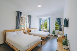 Postel nebo postele na pokoji v ubytování T&K Guesthouse