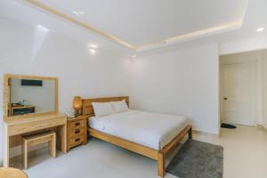 Postel nebo postele na pokoji v ubytování T&K Guesthouse