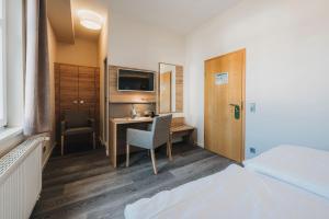 Postel nebo postele na pokoji v ubytování Hotel Restaurant Roemer