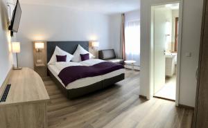 Postel nebo postele na pokoji v ubytování A Lotus Hotel