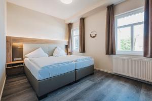 Postel nebo postele na pokoji v ubytování Hotel Restaurant Roemer