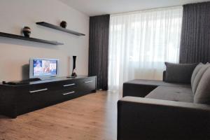 A television and/or entertainment centre at Annette Apartment