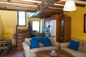 a living room with two couches and a table at La Escanda in La Rebollada