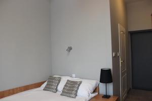Postel nebo postele na pokoji v ubytování Hotel Jan Sander