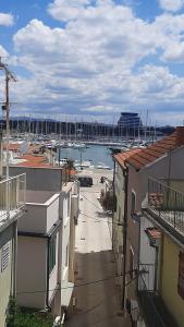 a view of a marina from between two buildings at House Vodice in Vodice