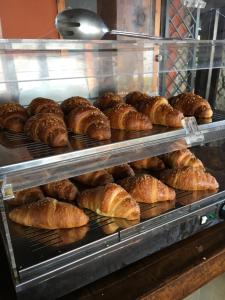 a display case filled with lots of croissants at casa vacanze marzano in Tropea