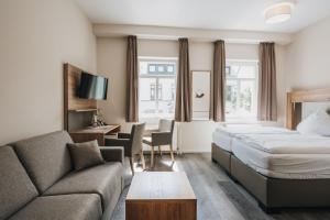 Postel nebo postele na pokoji v ubytování Hotel Restaurant Roemer