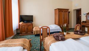 Postel nebo postele na pokoji v ubytování City Hotel UNIO superior + 27 fotografií