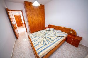 Postel nebo postele na pokoji v ubytování Apartments Cikuli