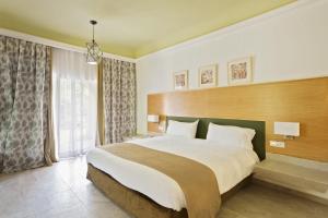 Postel nebo postele na pokoji v ubytování Hotel Riu Tikida Palmeraie - All Inclusive