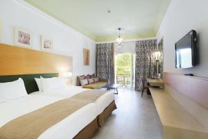 Postel nebo postele na pokoji v ubytování Hotel Riu Tikida Palmeraie - All Inclusive