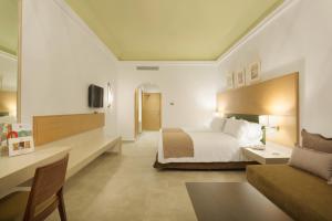 Postel nebo postele na pokoji v ubytování Hotel Riu Tikida Palmeraie - All Inclusive
