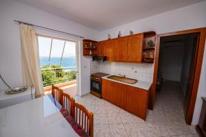 Kuchyň nebo kuchyňský kout v ubytování Apartments Cikuli
