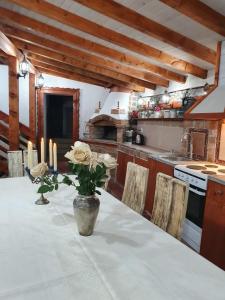 a kitchen with a table with candles on it at Kashtata s Paraklisa in Borowo