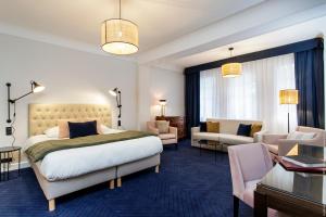 Postel nebo postele na pokoji v ubytování Le Manoir Hôtel