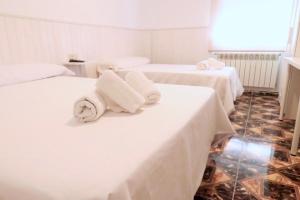 Postel nebo postele na pokoji v ubytování Hostal Jaufil