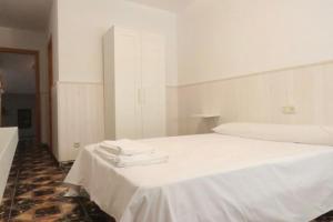 Postel nebo postele na pokoji v ubytování Hostal Jaufil