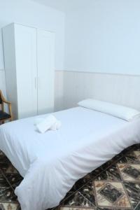 Postel nebo postele na pokoji v ubytování Hostal Jaufil