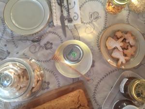 a table with a plate of bread and a glass of wine at La Grechea Boutique B&B in Casa Alzi