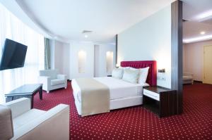 TV a/nebo společenská místnost v ubytování Sky Tower Hotel