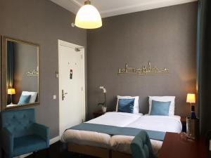 Voodi või voodid majutusasutuse Hotel Johannes Vermeer Delft toas