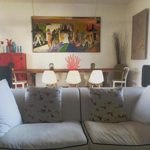 a living room with a couch and two lamps at La Grechea Boutique B&B in Casa Alzi