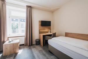 Postel nebo postele na pokoji v ubytování Hotel Restaurant Roemer