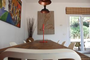 a table in a dining room with a drawing on the wall at La Grechea Boutique B&B in Casa Alzi