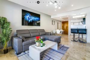 a living room with a couch and a table at Apartament Delux-La Entrada Punta Prima in Torrevieja