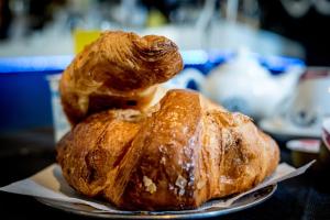 two loaves of bread on a plate on a table at Hotel Scigliano in Rossano